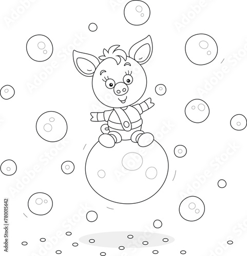 Funny cartoony little piglet riding on a big soap bubble among many other soapbubbles flying around, black and white vector cartoon illustration for a coloring book