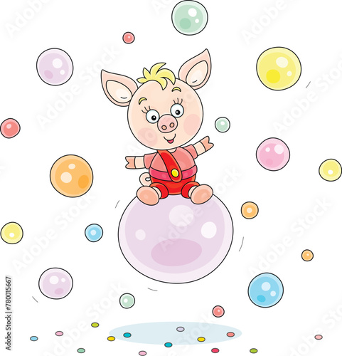 Funny cartoony little piglet riding on a big soap bubble among many other colorful soapbubbles flying around, vector cartoon illustration on a white background