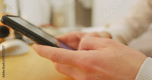 Young Mans hand Use smartphone for Write Send Message Close-up, side view. Fingers quickly correspond in a chat for dating.