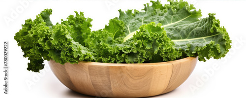 Fresh green kale vegetable in wooden bowl