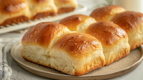 Golden delicious baked milk bread topped with sesame seeds for a fresh breakfast pastry