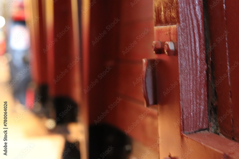 Railway wooden train carriage. An antique freight car made of wood close-up.