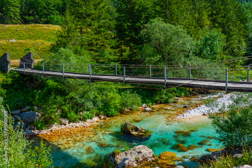 wooden bridge over soca river in Slovenia photo