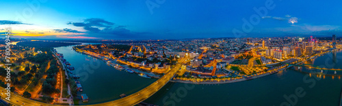 Fotografie Sunset over Downtown Belgrade viewed behind the Sava river in Se