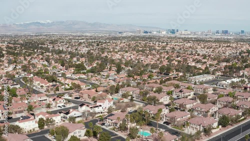 Aerial pullback view of Henderson Las Vegas suburban area with city skyline