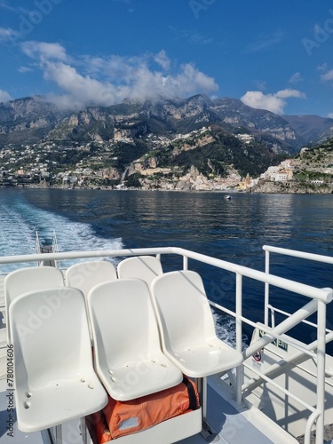 Amalfi panorama. Picturesque historic village on the famous Amalfi Coast in Campania Italy, world heritage area with colorful houses built on the coastline seen from tourist ferry.

