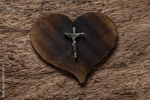 Symbols of Catholicism: Cross and wooden heart