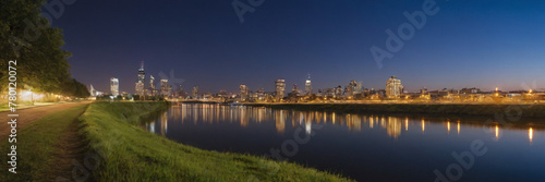 Sunset and Greater City in the background of a beautiful river lake