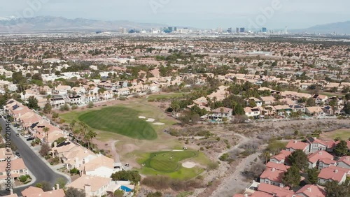 Aerial pullback view of Henderson Las Vegas residence, golf course, and skyline
