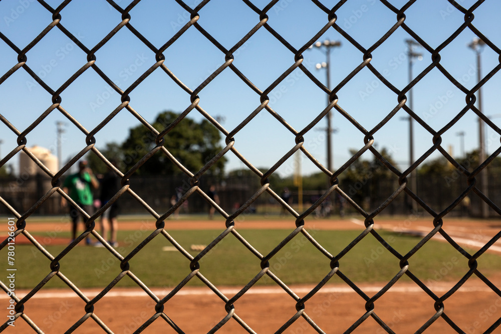 Focus on the fences with background Baseball field out of focus Focus on the fences with background Baseball field out of focus