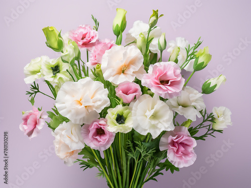 On a white backdrop  a bouquet of eustoma flowers boasts pink and white blooms