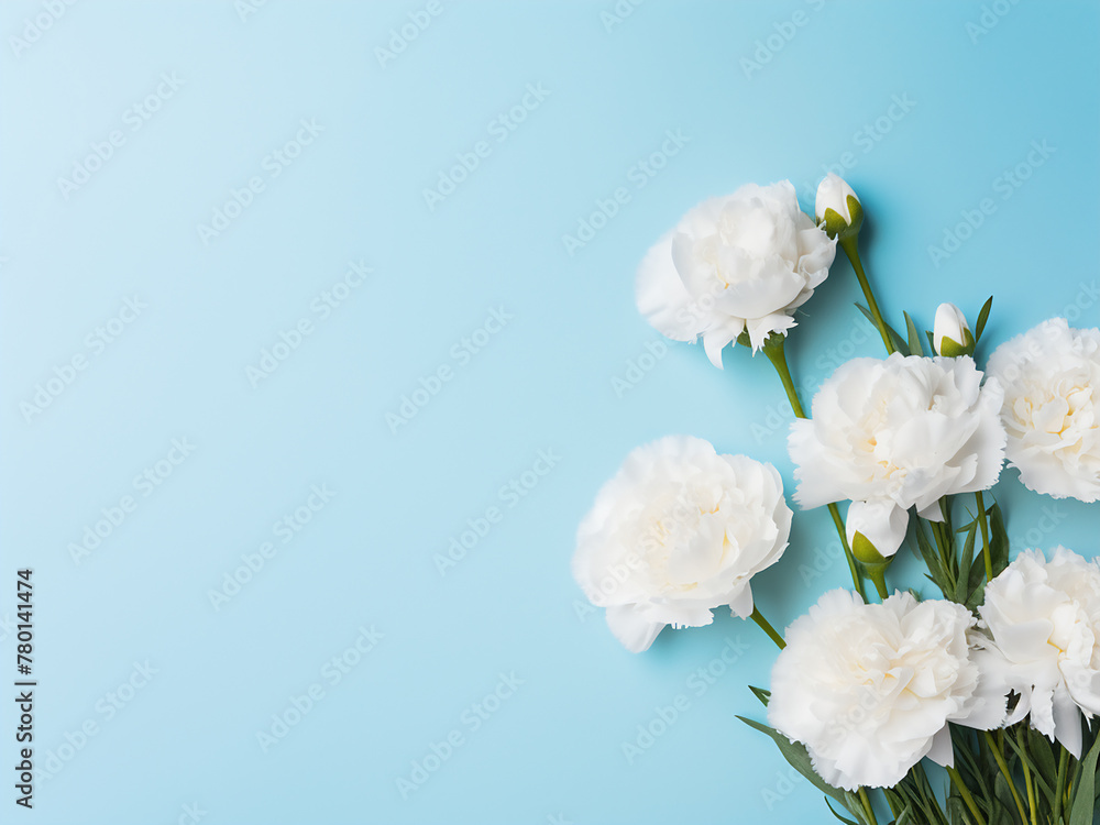 Fototapeta premium Four white carnations and eucalyptus arranged on blue for a romantic gesture