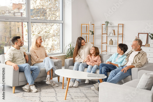 Big family sitting on sofas...