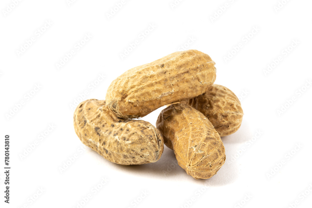 a macro closeup of several roasted peanuts in the shell isolated on white a macro closeup of several roasted peanuts in the shell isolated on white