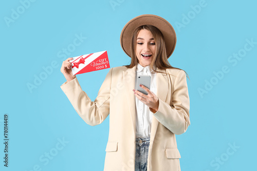 Young woman with gift vouch...