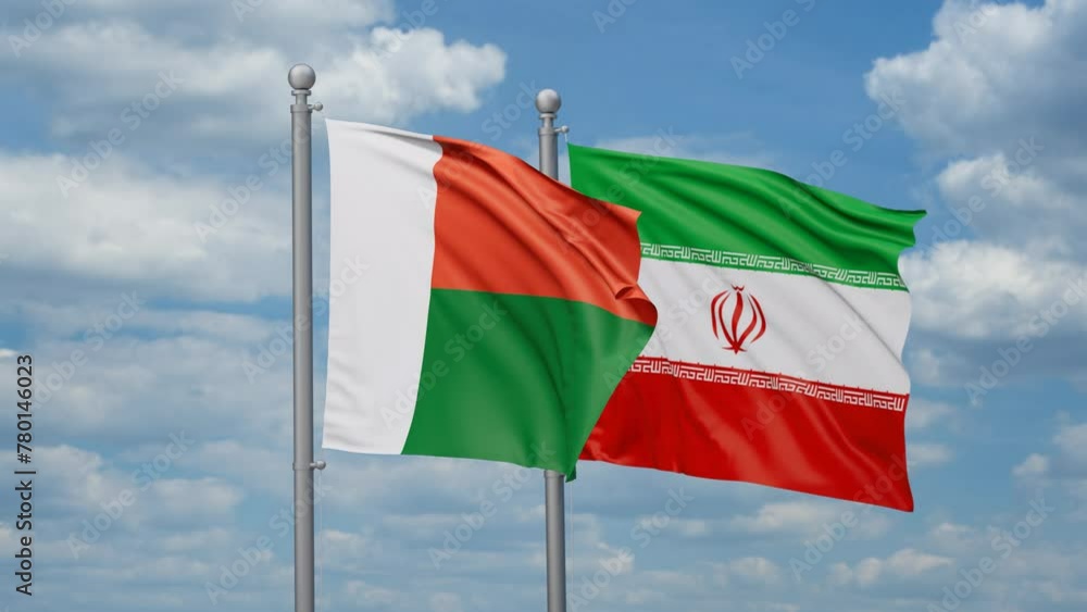 Iran and Madagascar two flags waving together on blue sky, looped video Iran and Madagascar two flags waving together on blue sky, looped video