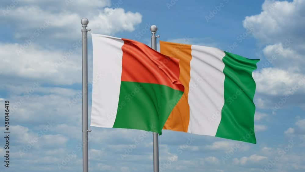 Ivory Coast or Cote d'Ivoire and Madagascar two flags waving together, looped video, two country cooperation concept Ivory Coast or Cote d'Ivoire and Madagascar two flags waving together, looped video, two country cooperation concept