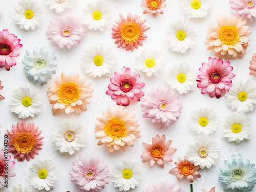 Flowers arranged in a pattern on a white background, captured from above in a mock-up