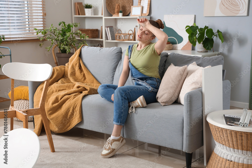 Tired beautiful young woman assembling furniture at home Tired beautiful young woman assembling furniture at home