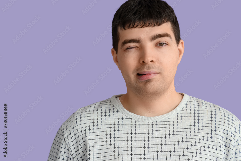 Young man on lilac background, closeup. National Cerebral Palsy Awareness Month Young man on lilac background, closeup. National Cerebral Palsy Awareness Month