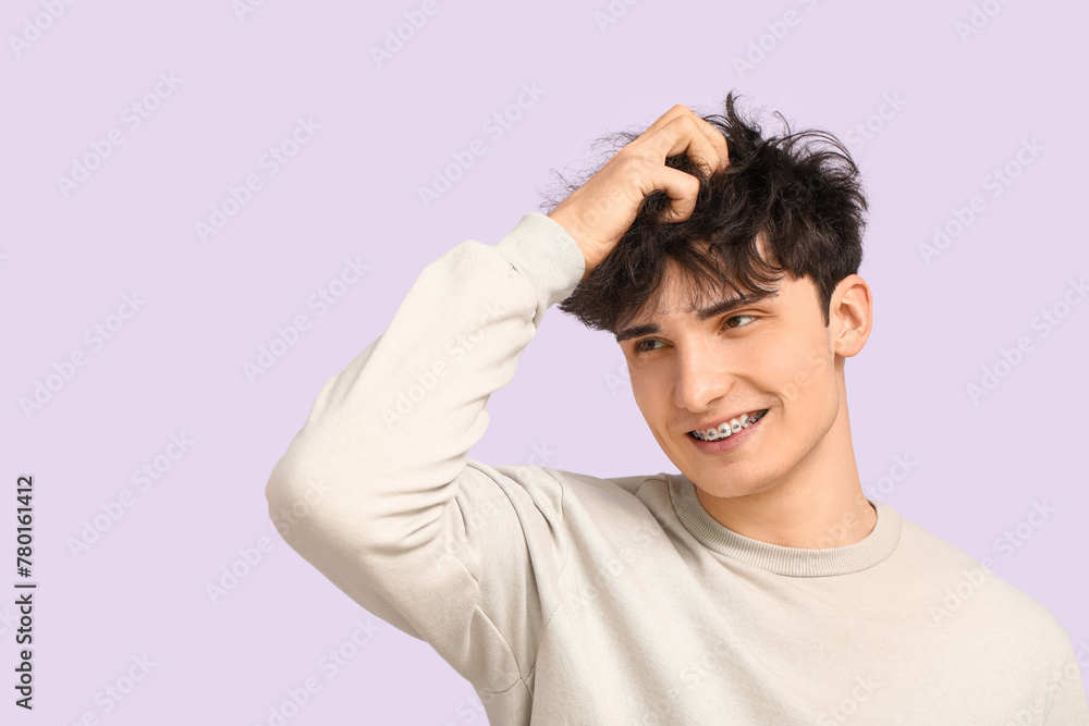Young dark haired man on light background Young dark haired man on light background