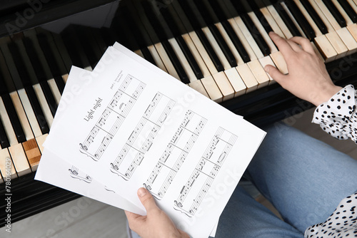 Woman with music sheets pla...