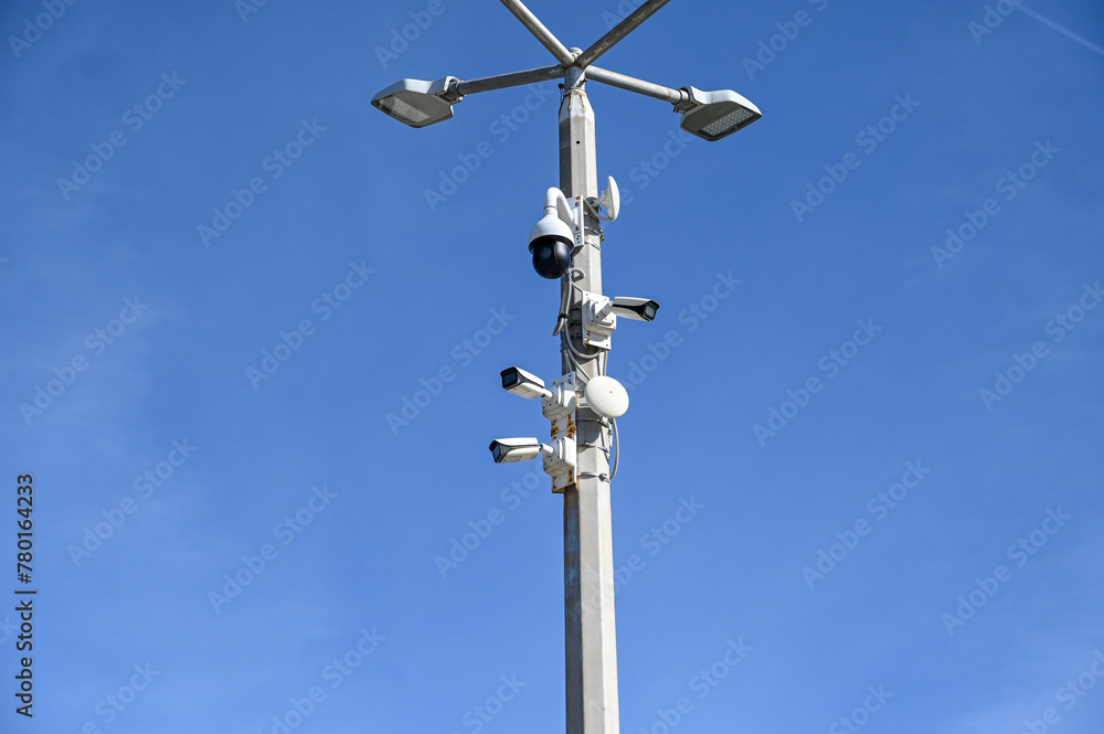 CCTV cameras on the pole. A lot of professional Security cameras scanning the street. Recording video. Concept of surveillance, privacy, criminal, spy, protection and safety.