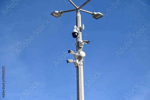CCTV cameras on the pole. A lot of professional Security cameras scanning the street. Recording video. Concept of surveillance, privacy, criminal, spy, protection and safety.