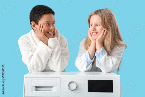 Children near washing machi...