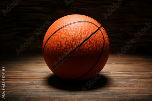 Ball for playing basketball on wooden background © Pixel-Shot
