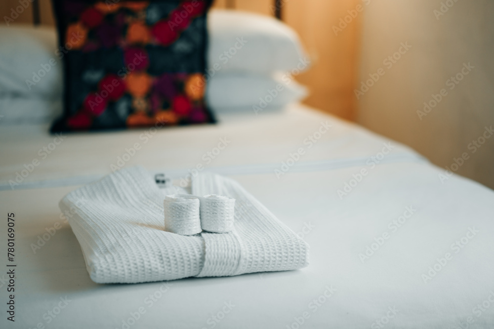 Fototapeta premium white bathrobe on the bed