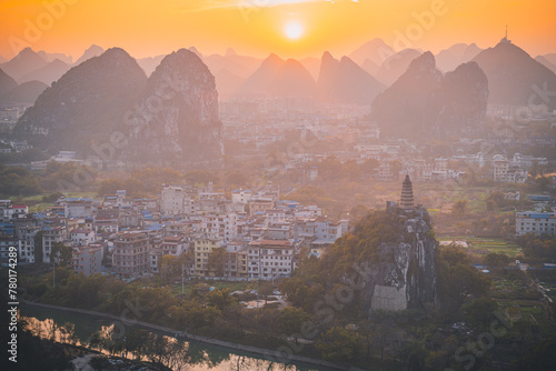 Sunset over the Guilin city surrounded by picturesque limestone mountains