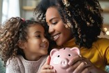 African American mother and daughter saving money in piggy bank, financial education concept