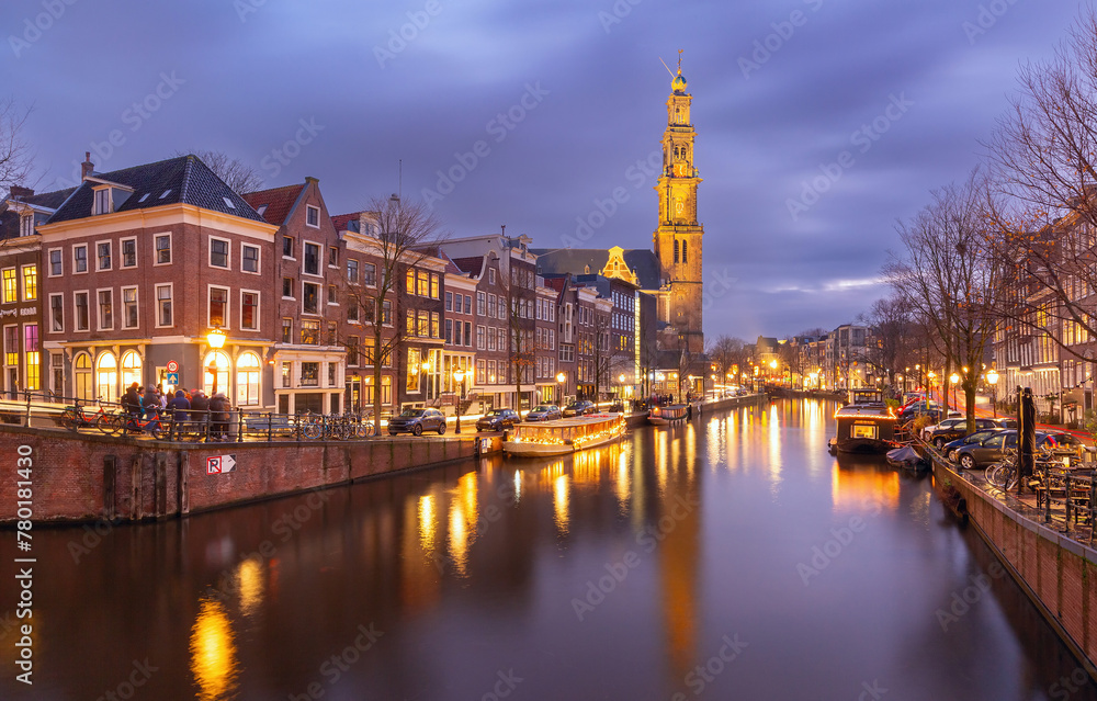 Night city view of Amsterdam canal Prinsengracht and Westerkerk church, Holland, Netherlands