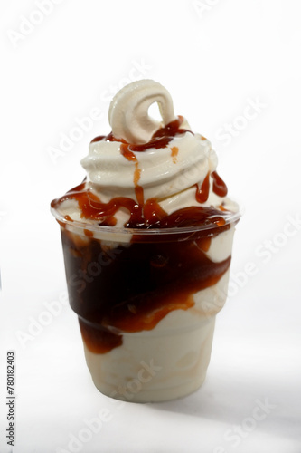 Panoramic still life of ice cream slush frozen colorful frozen fruit granita drinks flowing into takeaway plastic cups with ice cream straws flavor photo