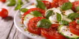 Classic Caprese Salad with Tomato, Mozzarella, Basil, Olive Oil and Balsamic Vinegar Glaze 