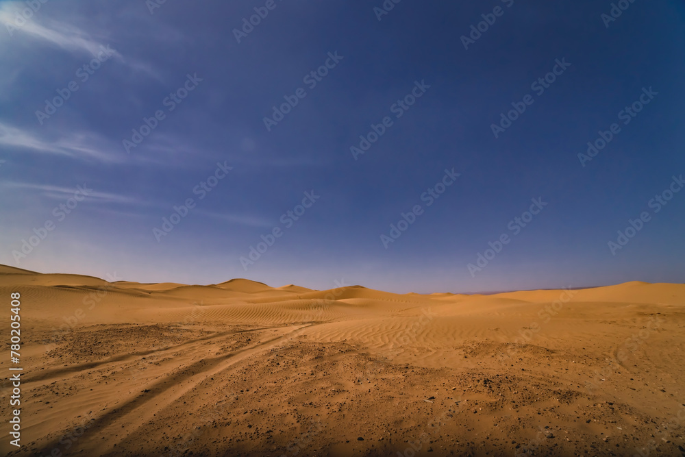 A panoramic sand dune of sahara desert at Mhamid el Ghizlane in Morocco wide shot