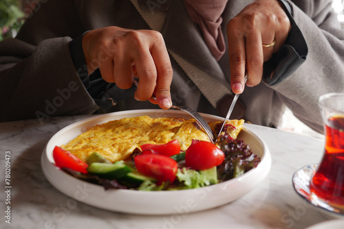 eating Plain Egg Omelette on table  © Towfiqu Barbhuiya 