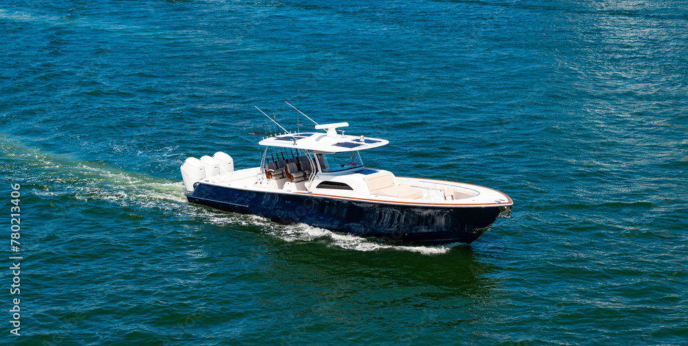 Motor private yacht in sea. Yacht in navigation. Private boat off the beach. Summer vacation. Summertime yachting. Yacht vacation in summer. Boat trip. Travel and adventure