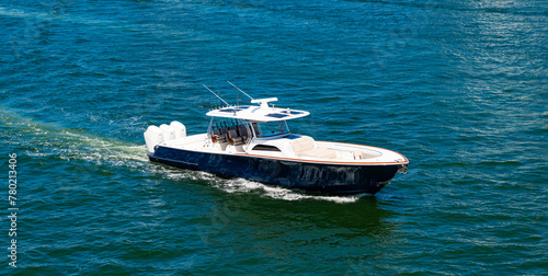 Motor private yacht in sea. Yacht in navigation. Private boat off the beach. Summer vacation. Summertime yachting. Yacht vacation in summer. Boat trip. Travel and adventure © be free