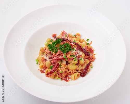 Stir-fried Macaroni dried chili with ham and bacon topped with parsley, dried chilli, sliced spring onion, fried garlic, and cheese.