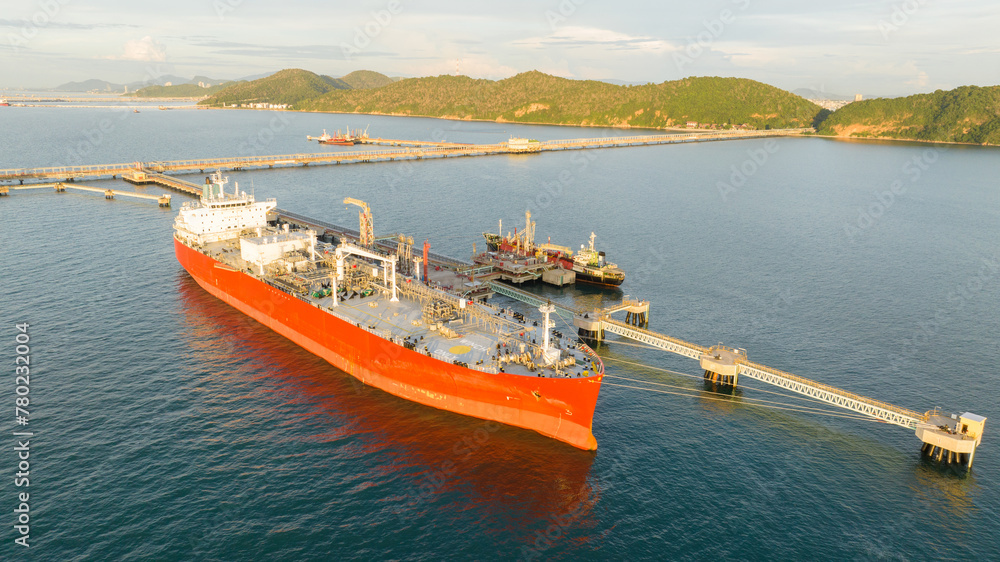 Fototapeta premium Oil tanker ship. Red Oil Tanker runing in the ocean sea. petroleum ship transportation import export fuel energy across red ocean sea. Vessel transport Gas to customs.