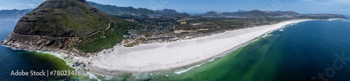 panoramic aerial landscape view the famous, natural very long Noordhoek Beach with white sand beach and Chapman's peak mountain  photo