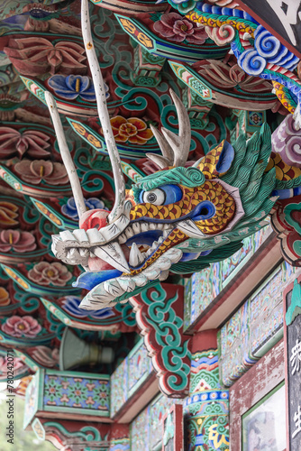 Closeup of wooden dragon carving with colorful Dancheong painting, Busan city, South Korea - April, 2017