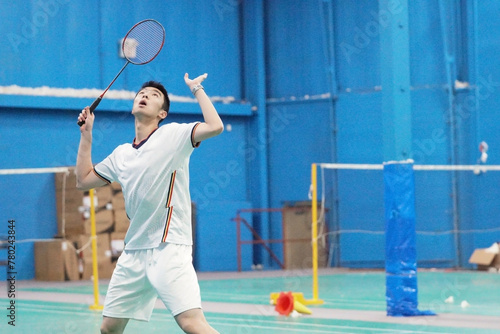 young man plays single badminton