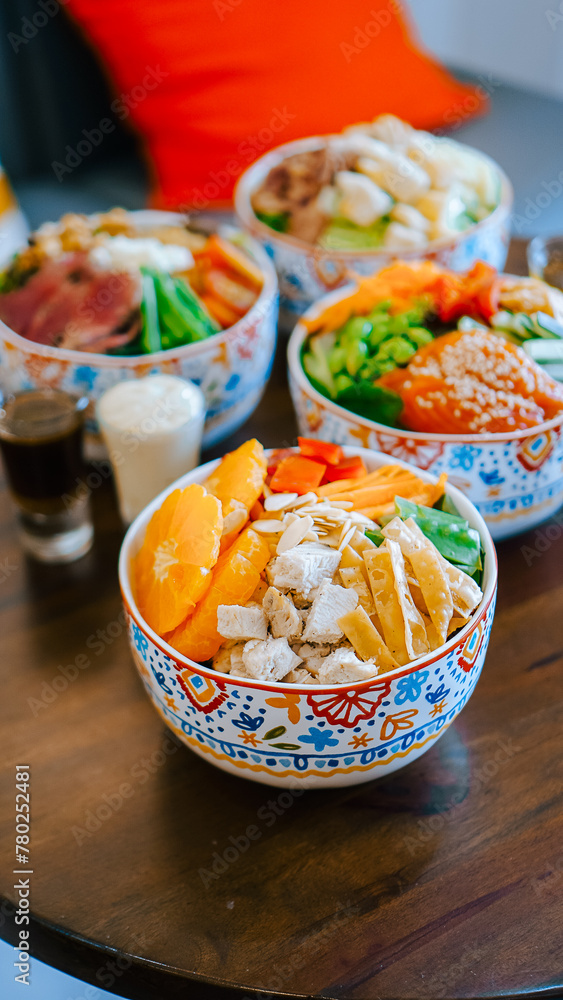 Wooden Table With Assorted Food Bowls - Delicious Lunch Spread for Family Gathering Feast Party Wooden Table With Assorted Food Bowls - Delicious Lunch Spread for Family Gathering Feast Party