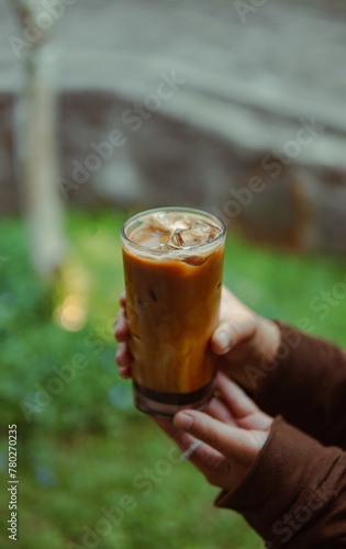 Kopi susu gula aren Person Holding Drink in Hand, Refreshment in Hand, Simple and Elegant