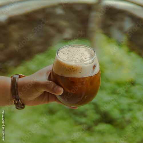 Person Holding a Beer in Their Hand