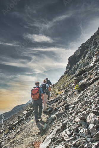 Three friends during an alpine trek