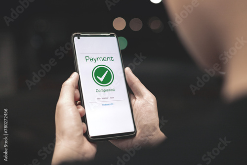 Payment complete Notifications. Customer using online banking application on smartphone to pay for purchases online and product in department store